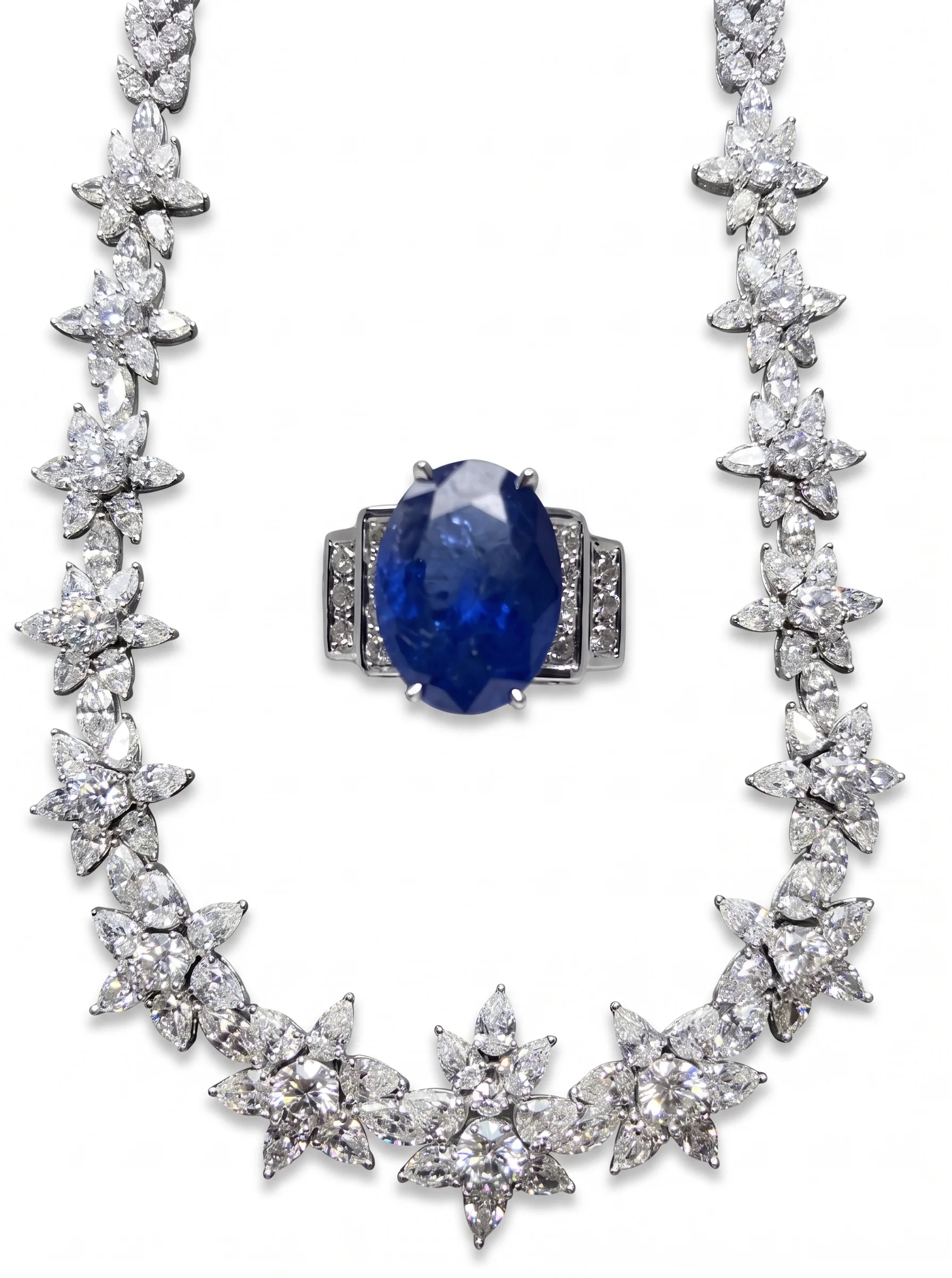 Diamond cluster necklace with central sapphire and diamond ring