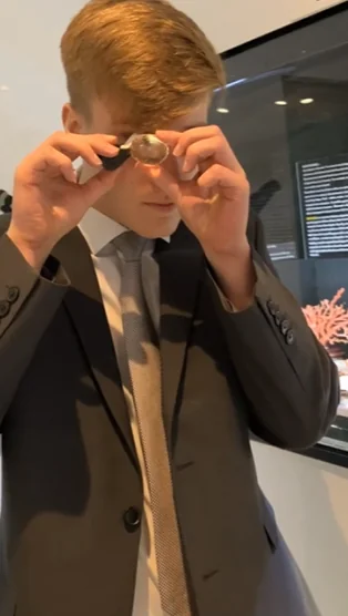 Lab technician holding a gemstone for inspection